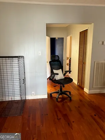 a bedroom with a bed and a mirror