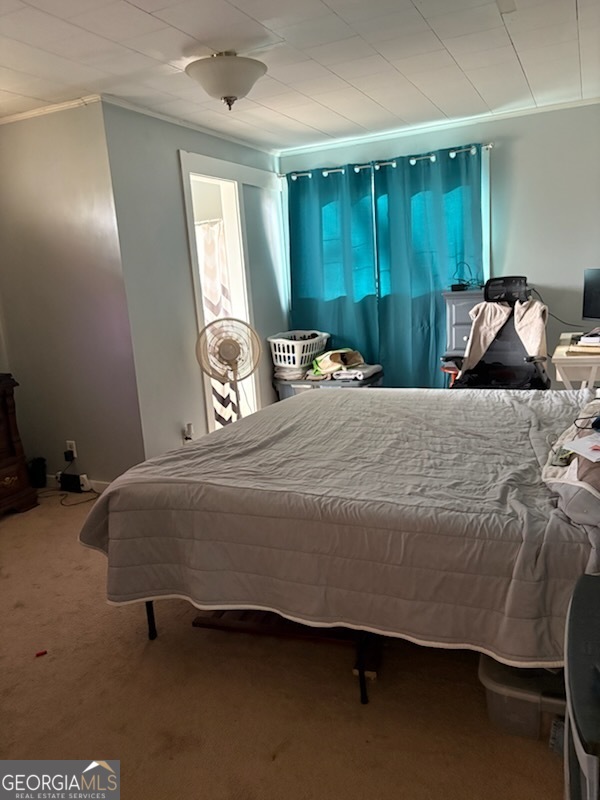 508 Pine Street West Point, GA 31833 - Photo 12 of 22 a bedroom with a bed and a mirror