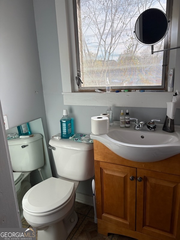 508 Pine Street West Point, GA 31833 - Photo 15 of 22 a bathroom with a toilet a sink and mirror