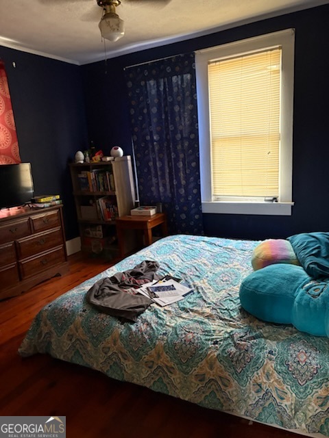 508 Pine Street West Point, GA 31833 - Photo 18 of 22 a bedroom with a bed and wooden floor