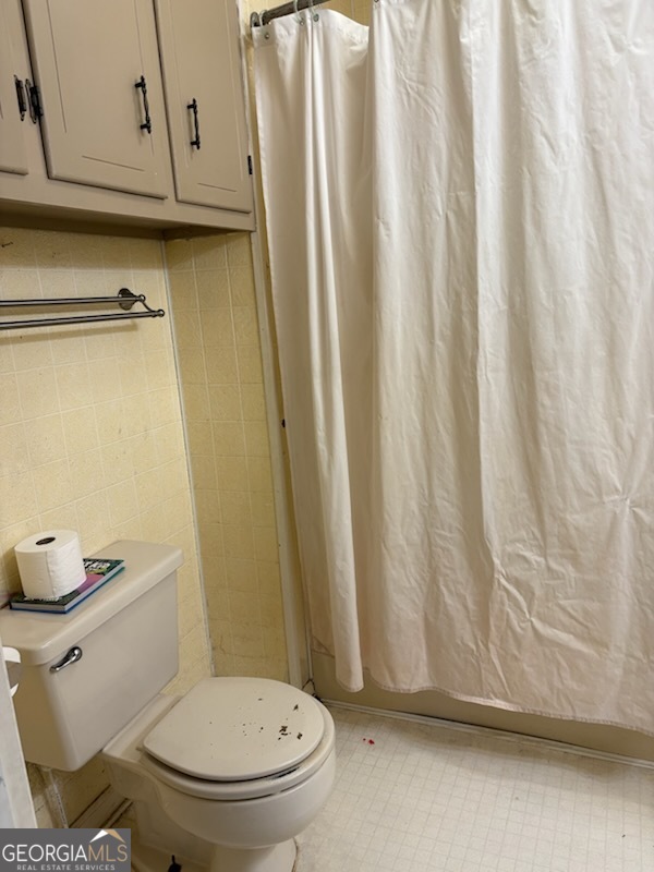 508 Pine Street West Point, GA 31833 - Photo 20 of 22 a bathroom with a granite countertop toilet and a sink