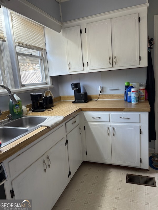 508 Pine Street West Point, GA 31833 - Photo 9 of 22 a kitchen with stainless steel appliances white cabinets and a sink