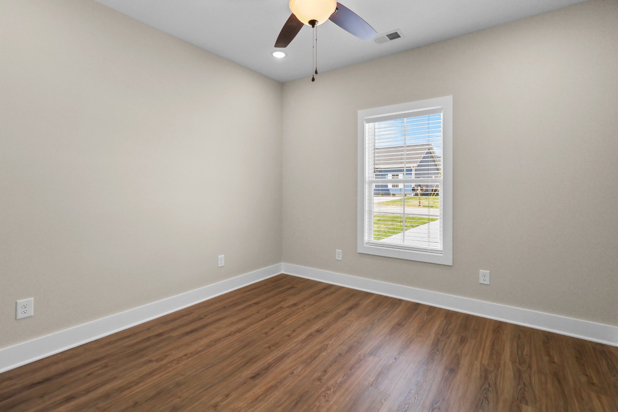 1004 Oak Street, Unit B Portland, TN 37148 - Photo 20 of 29 an empty room with wooden floor and windows