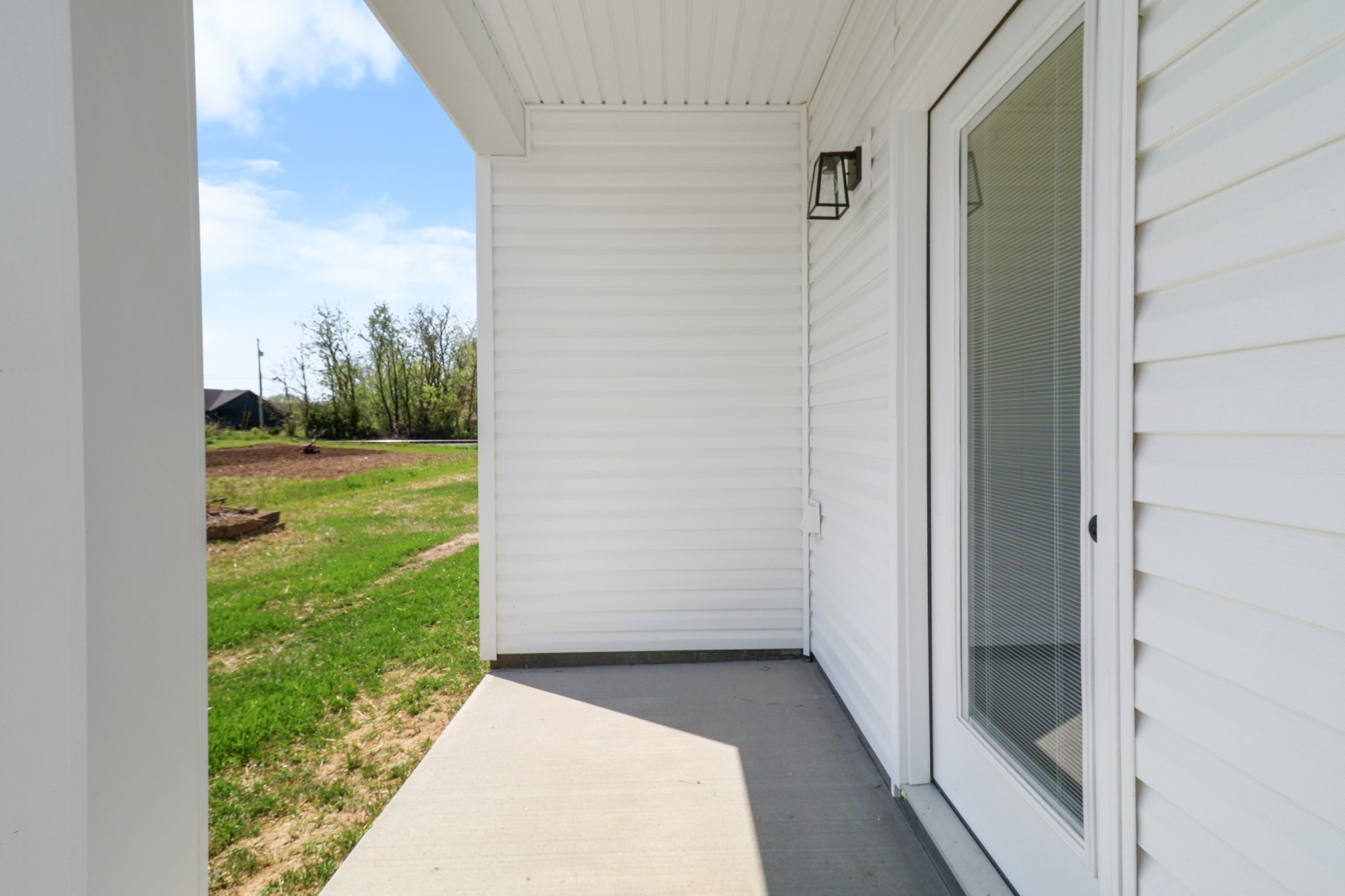 1004 Oak Street, Unit B Portland, TN 37148 - Photo 26 of 29 a view of a back yard from a corridor