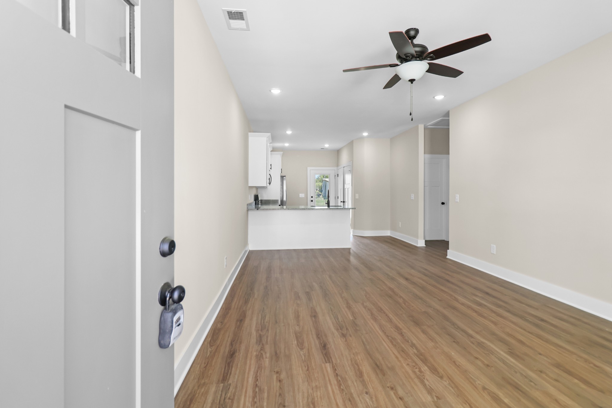 1004 Oak Street, Unit B Portland, TN 37148 - Photo 3 of 29 wooden floor in an empty room with a window