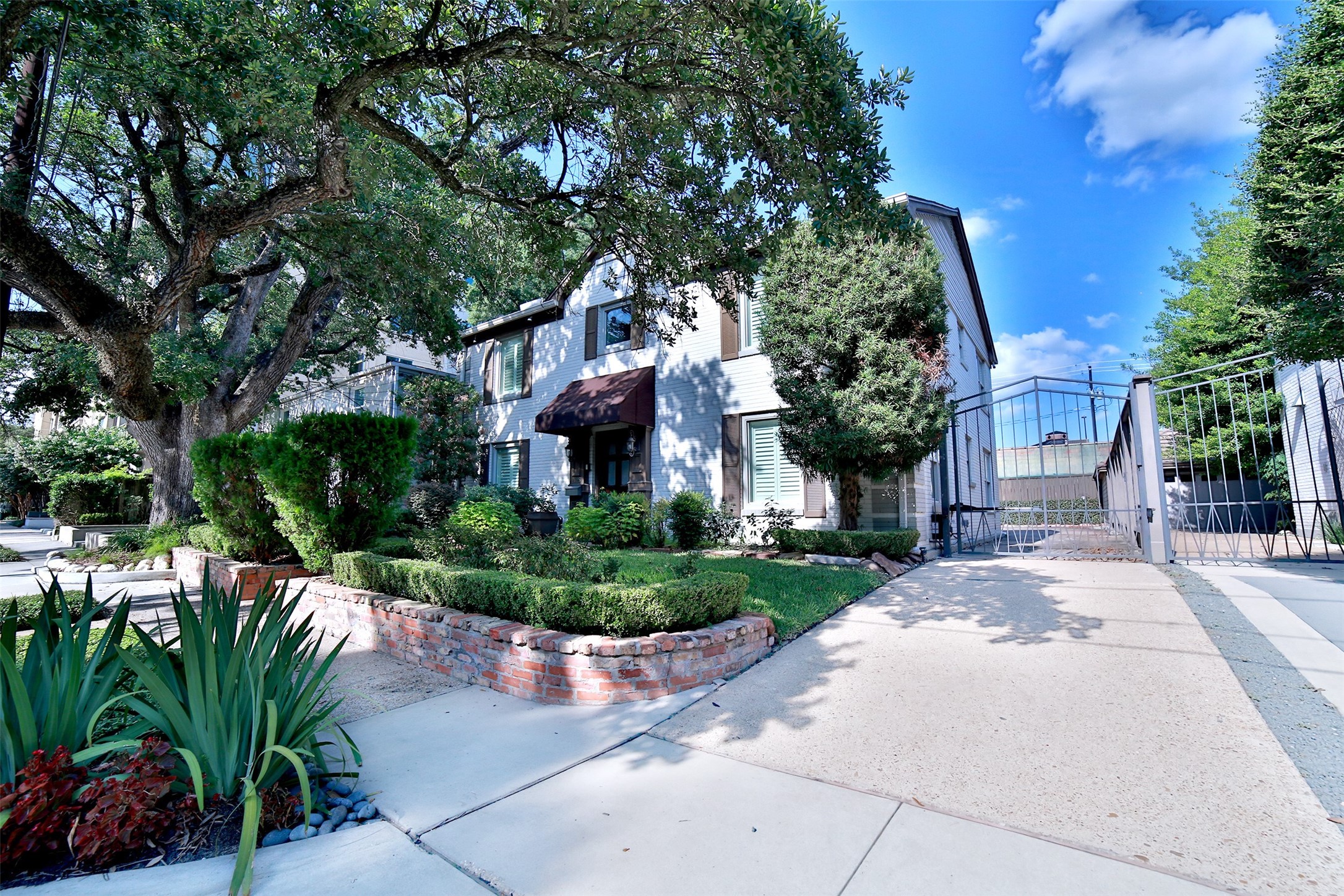 2625 Peckham Street Houston, TX 77098 - Photo 2 of 27 a front view of a house with a garden