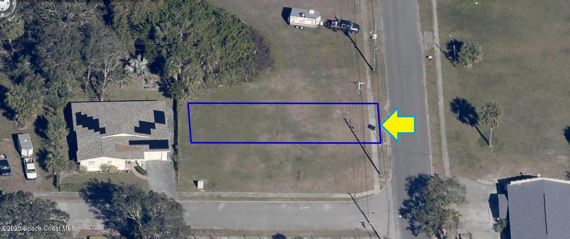 an aerial view of a house with a swimming pool