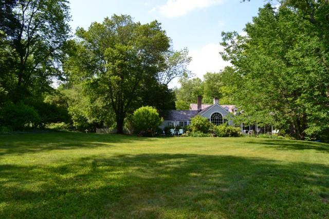157 Huckleberry Hill Road Wilton, CT 06897 - Photo 1 of 1 a view of a big yard with large trees