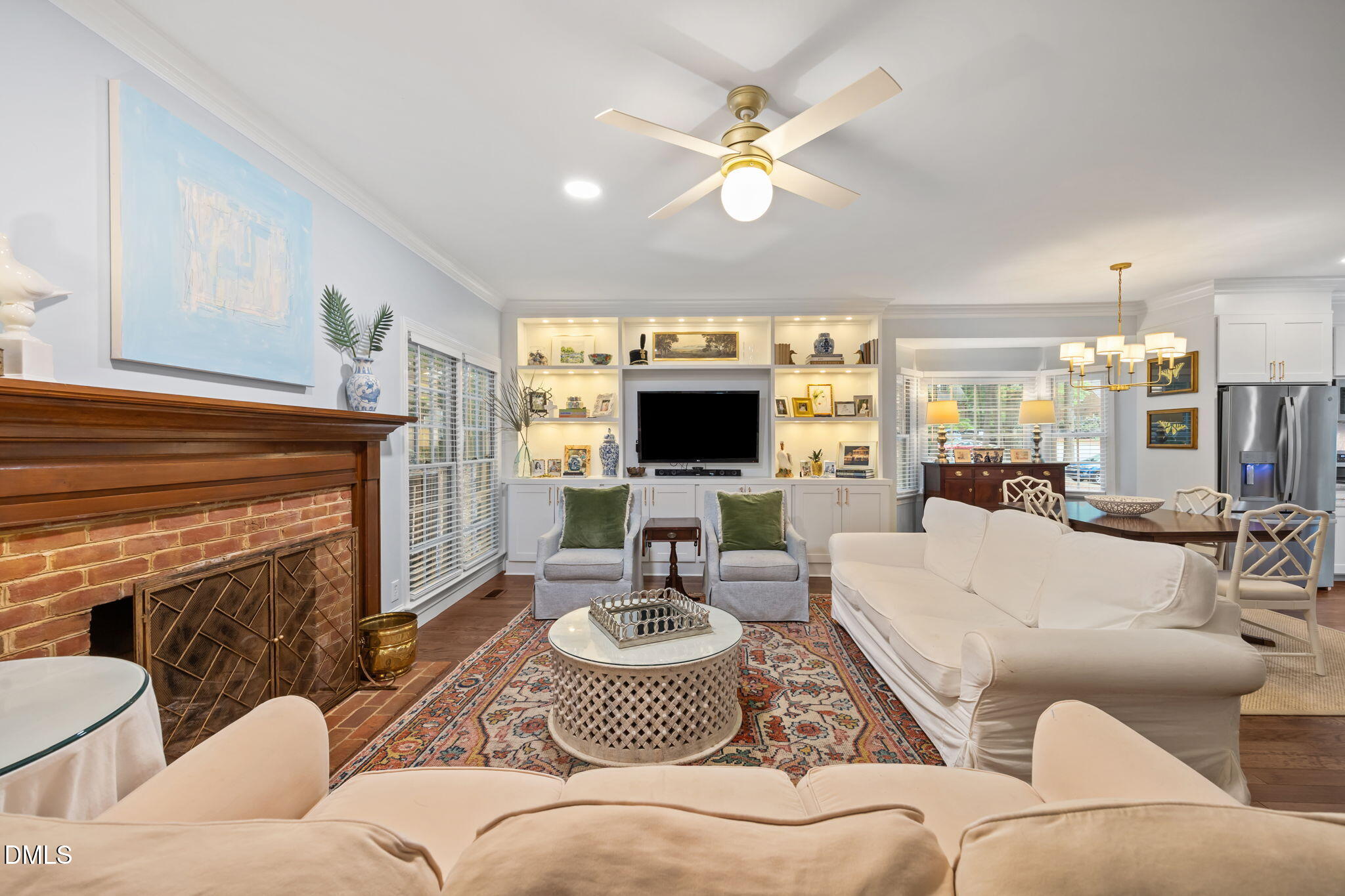 562 Weathergreen Drive Raleigh, NC 27615 - Photo 11 of 47 a living room with furniture and a flat screen tv