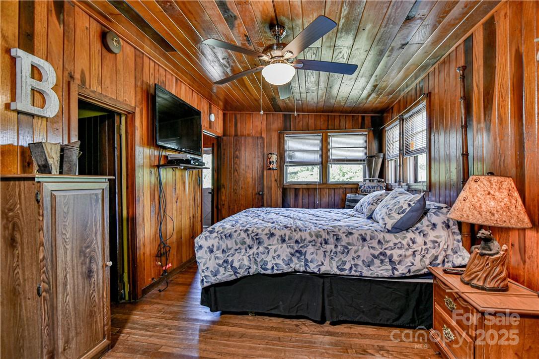 415 Weaverville Road Asheville, NC 28804 - Photo 20 of 47 a bedroom with a bed and a large window