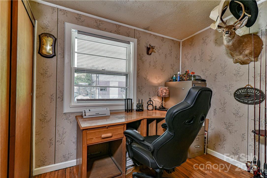 415 Weaverville Road Asheville, NC 28804 - Photo 23 of 47 a work room with furniture and windows