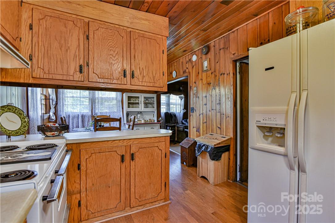 415 Weaverville Road Asheville, NC 28804 - Photo 29 of 47 a kitchen with stainless steel appliances granite countertop a refrigerator and a stove top oven