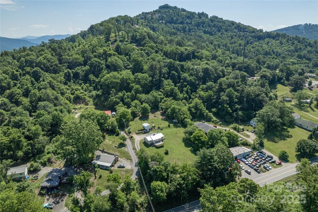 415 Weaverville Road Asheville, NC 28804 - Photo 3 of 47 an aerial view of residential house with outdoor space and trees all around