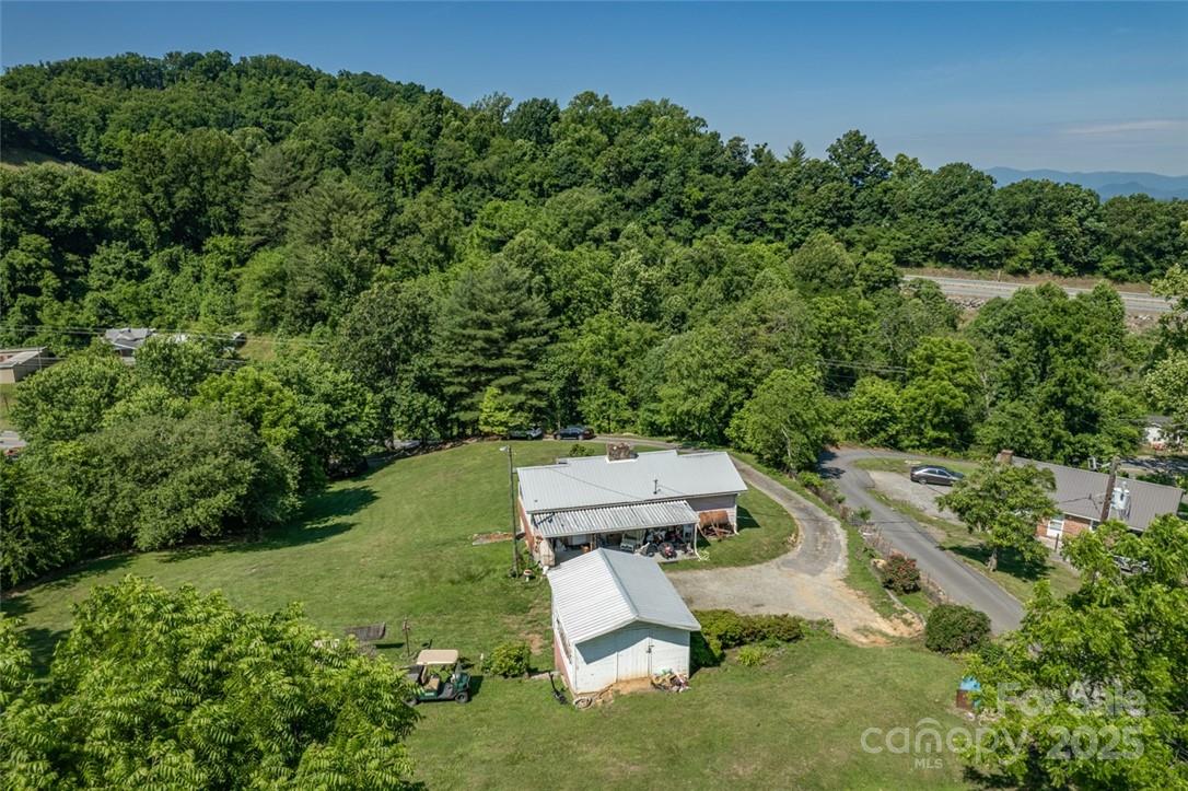 415 Weaverville Road Asheville, NC 28804 - Photo 38 of 47 an aerial view of a house with a yard