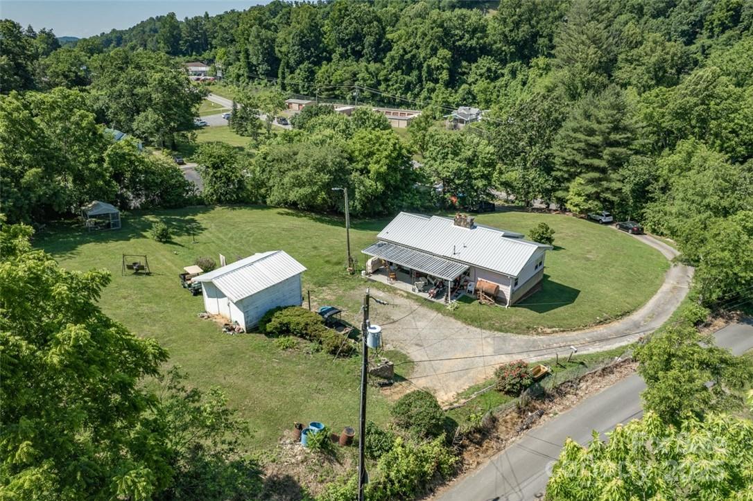 415 Weaverville Road Asheville, NC 28804 - Photo 40 of 47 an aerial view of a house with garden space and street view