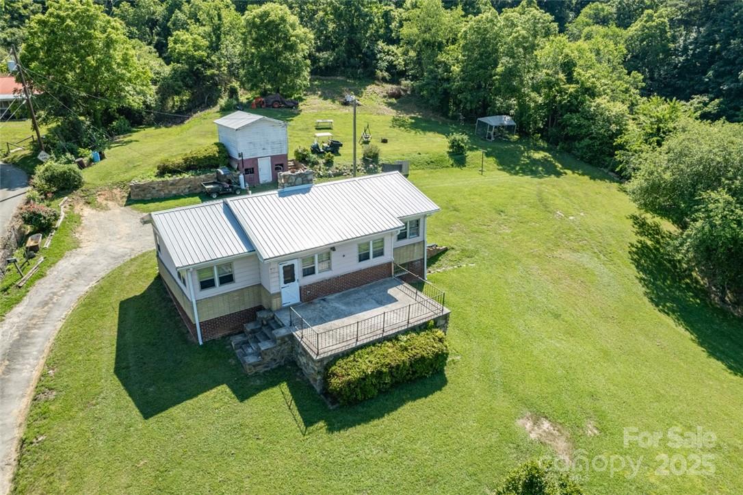415 Weaverville Road Asheville, NC 28804 - Photo 4 of 47 an aerial view of a house with swimming pool and large trees