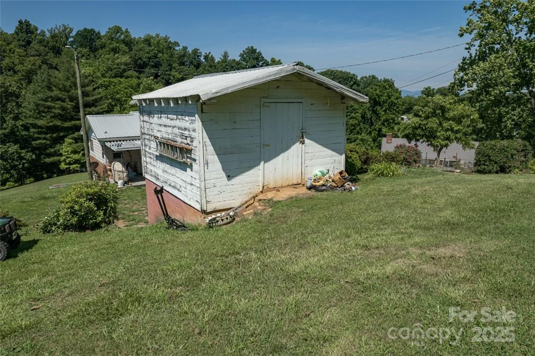 415 Weaverville Road Asheville, NC 28804 - Photo 44 of 47 a view of a wooden house with a yard