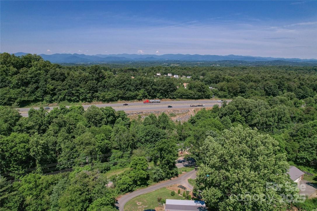 415 Weaverville Road Asheville, NC 28804 - Photo 46 of 47 a view of a big yard with a house in the background