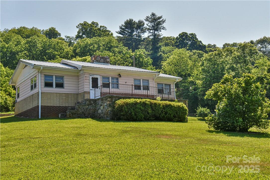 415 Weaverville Road Asheville, NC 28804 - Photo 5 of 47 a view of a house with a yard