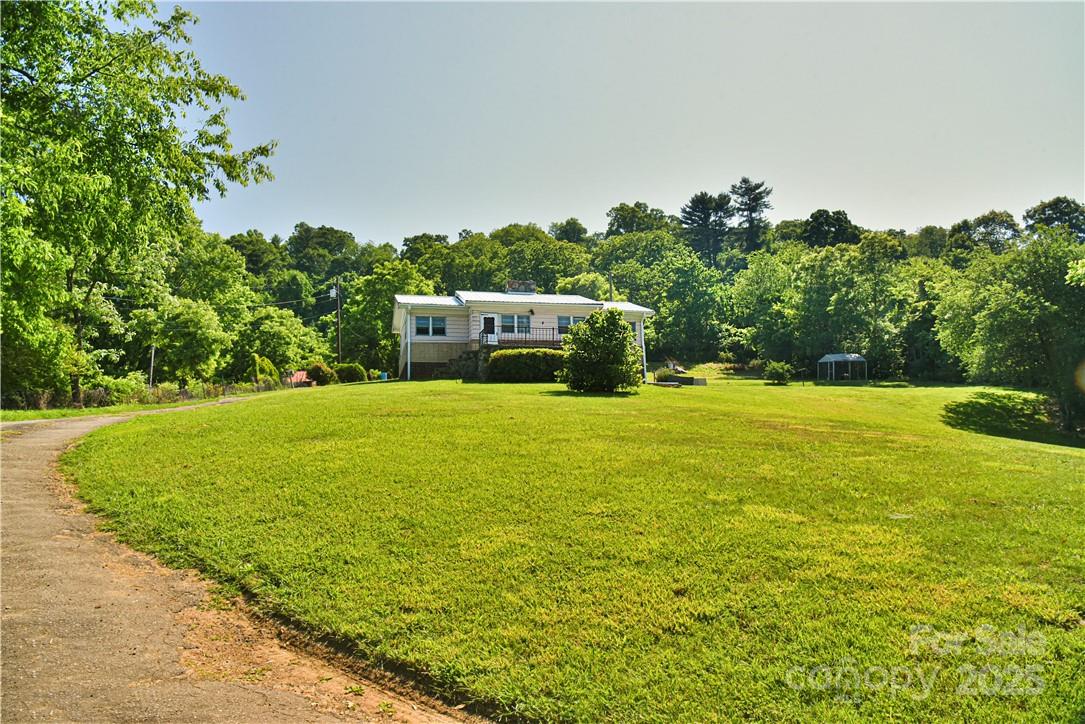 415 Weaverville Road Asheville, NC 28804 - Photo 6 of 47 a view of a house with a yard
