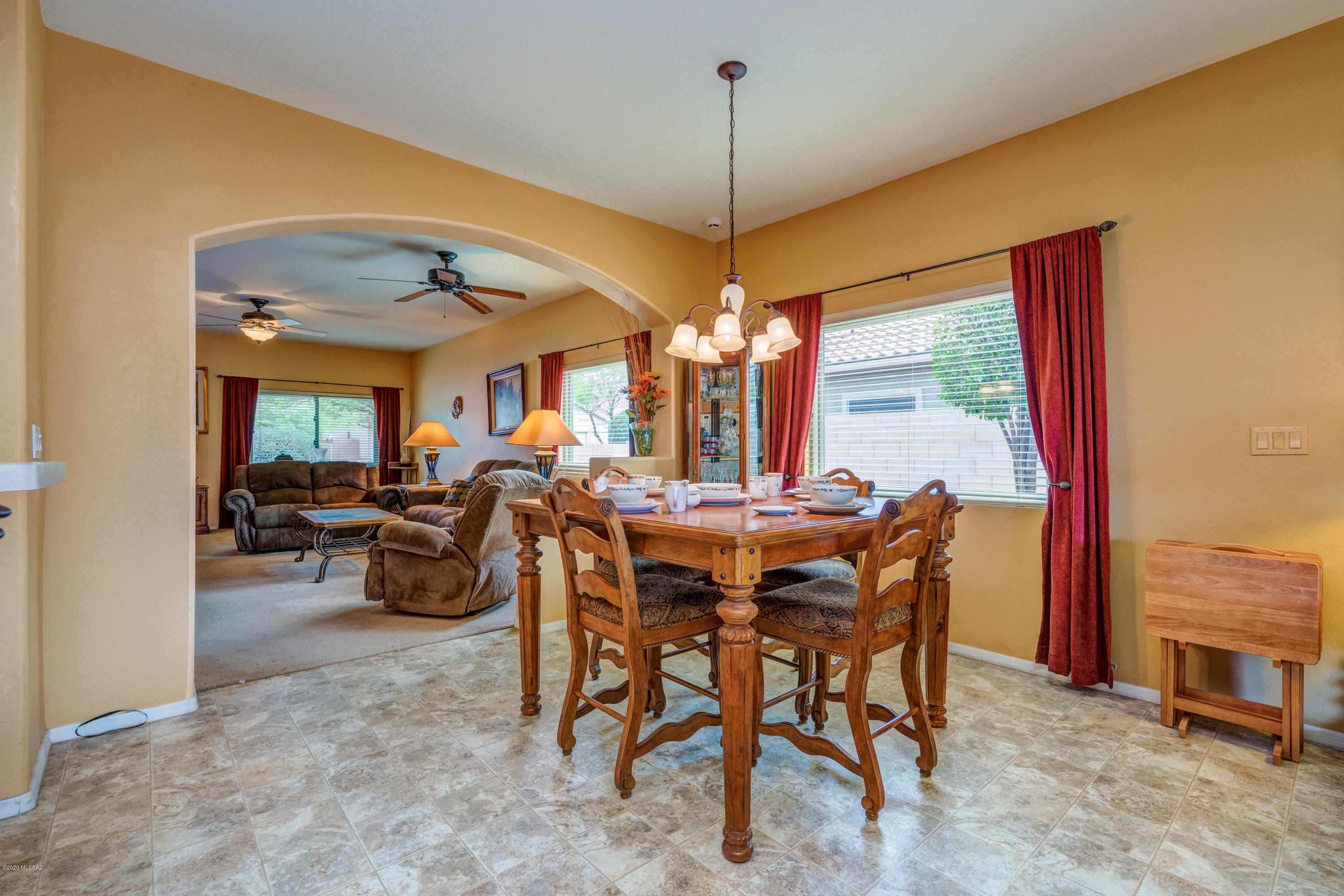 3640 East Northern Dancer Road Tucson, AZ 85739 - Photo 18 of 47 a view of a dining room with furniture window and outside view