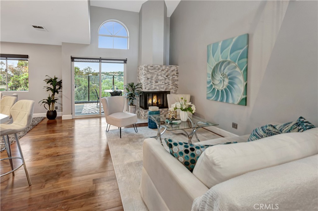 32395 Outrigger Way Laguna Niguel, CA 92677 - Photo 5 of 33 Living room fireplace and patio with beautiful view