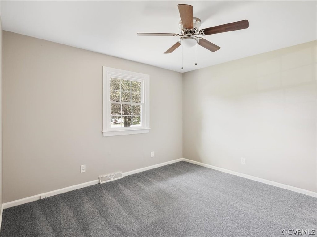 15531 Saddlebrook Road Chesterfield, VA 23838 - Photo 11 of 15 an empty room with a window and a fan