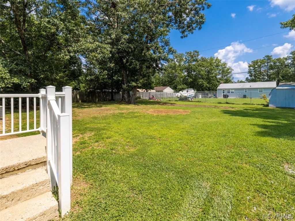 15531 Saddlebrook Road Chesterfield, VA 23838 - Photo 14 of 15 a view of a swimming pool with an outdoor seating and a yard