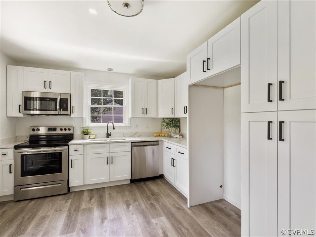 15531 Saddlebrook Road Chesterfield, VA 23838 - Photo 2 of 15 a kitchen with stainless steel appliances granite countertop a stove a sink and a refrigerator
