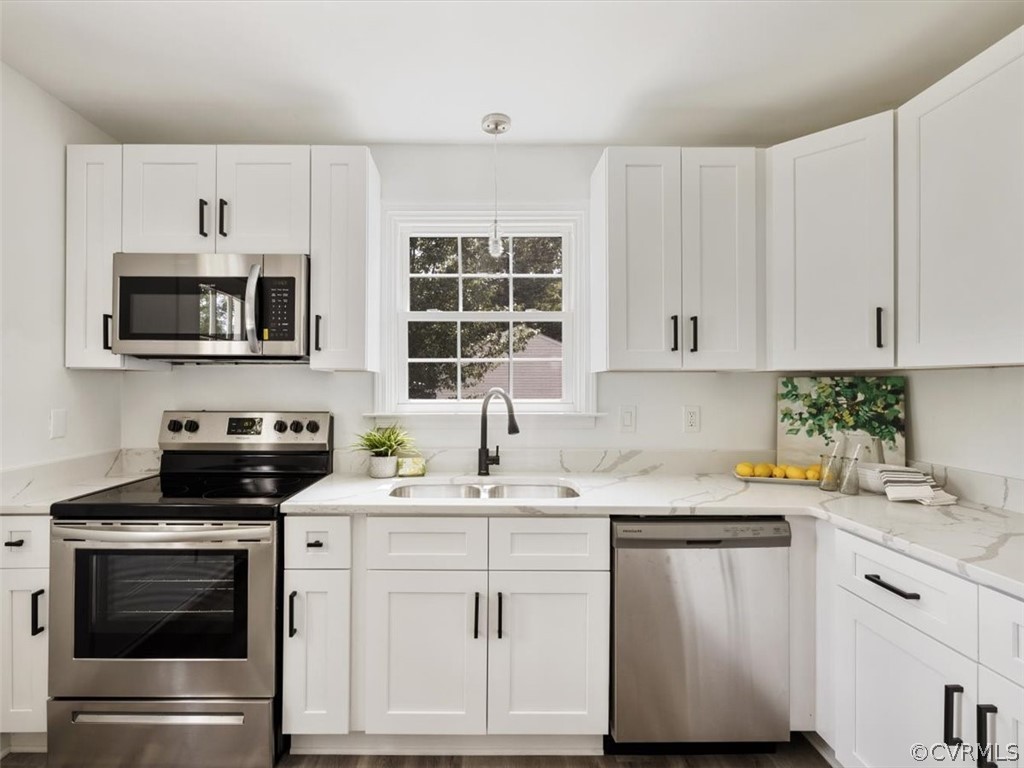 15531 Saddlebrook Road Chesterfield, VA 23838 - Photo 6 of 15 a kitchen with stainless steel appliances granite countertop a sink stove oven a sink and dishwasher with cabinets