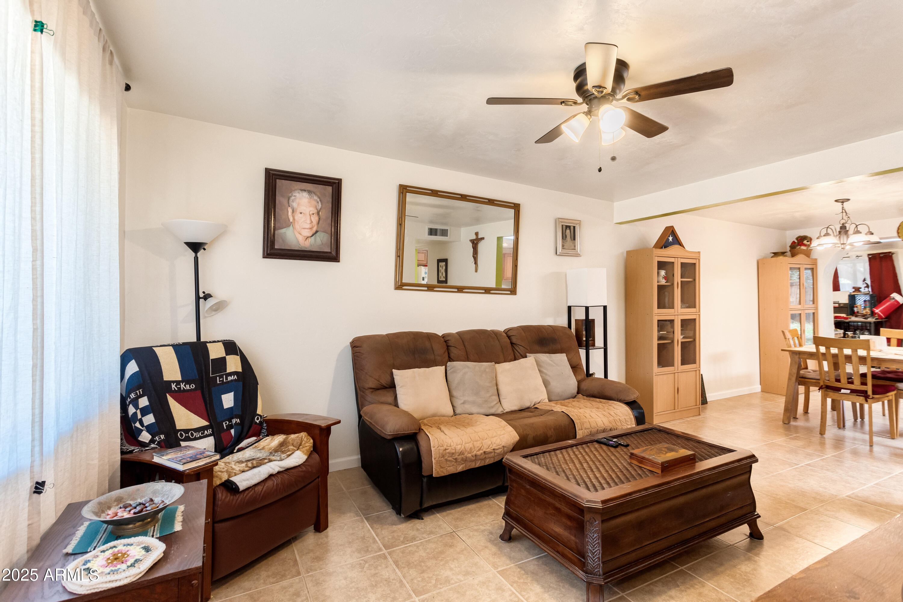 4964 East Raffaele Avenue Sierra Vista, AZ 85635 - Photo 11 of 41 a living room with furniture a rug and a window
