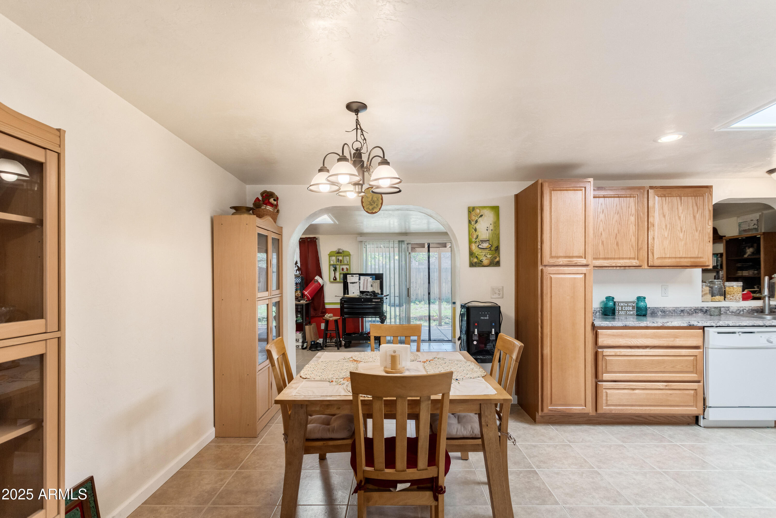 4964 East Raffaele Avenue Sierra Vista, AZ 85635 - Photo 12 of 41 a view of a dining room with furniture window and wooden floor