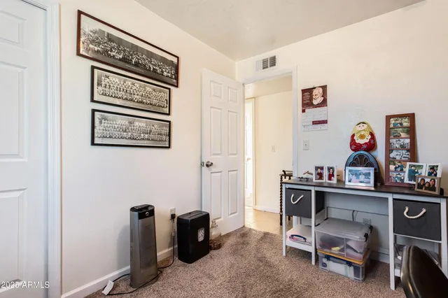 a view of a workspace with furniture