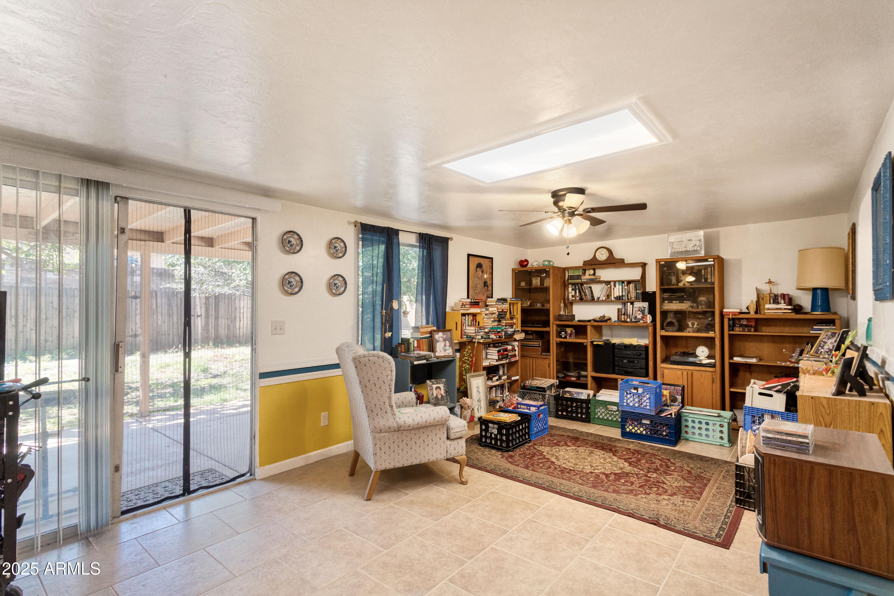 4964 East Raffaele Avenue Sierra Vista, AZ 85635 - Photo 29 of 41 a living room with lots of furniture and a chandelier