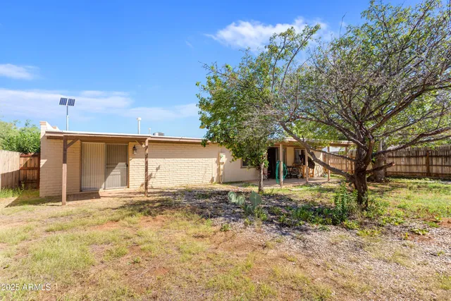 a house with trees in front of it