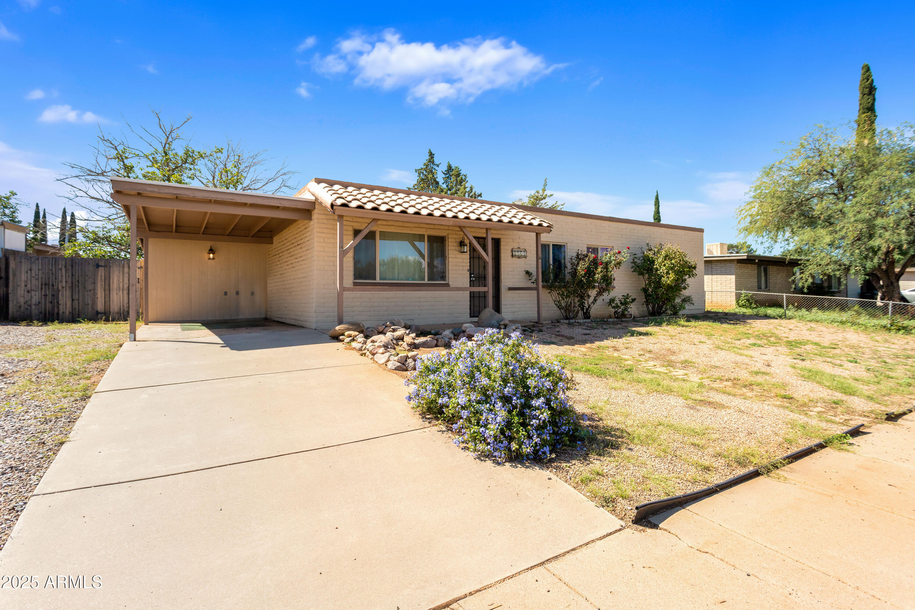 4964 East Raffaele Avenue Sierra Vista, AZ 85635 - Photo 5 of 41 a front view of a house with a yard