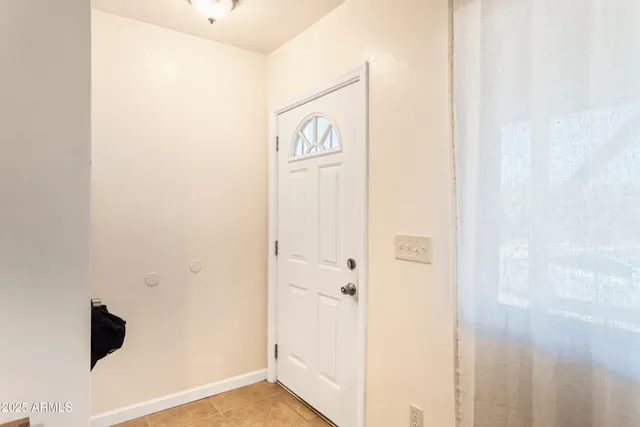a view of front door with wooden floor