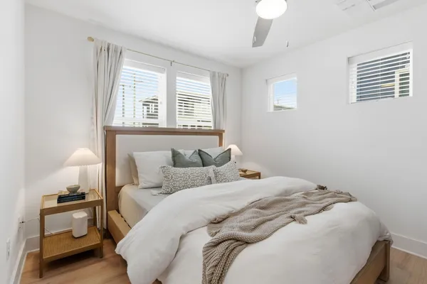 a bedroom with a bed and a window