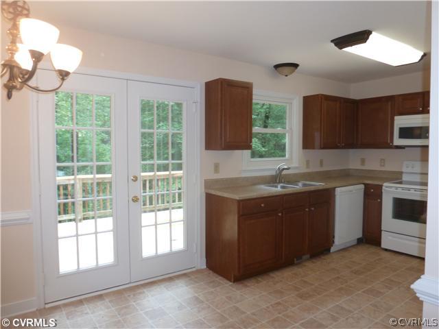 7900 Reedy Branch Road Chesterfield, VA 23838 - Photo 3 of 12 a kitchen with a sink cabinets and window