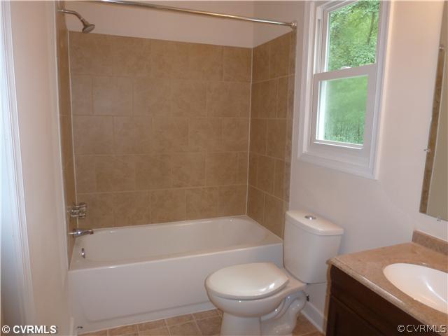 7900 Reedy Branch Road Chesterfield, VA 23838 - Photo 9 of 12 a white bath tub sitting next to a toilet