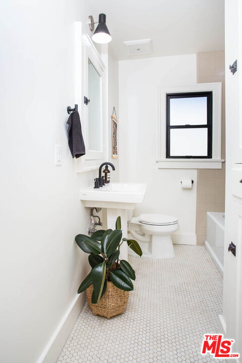 3756 Dover Place Los Angeles, CA 90039 - Photo 12 of 19 a bathroom with a sink and a mirror
