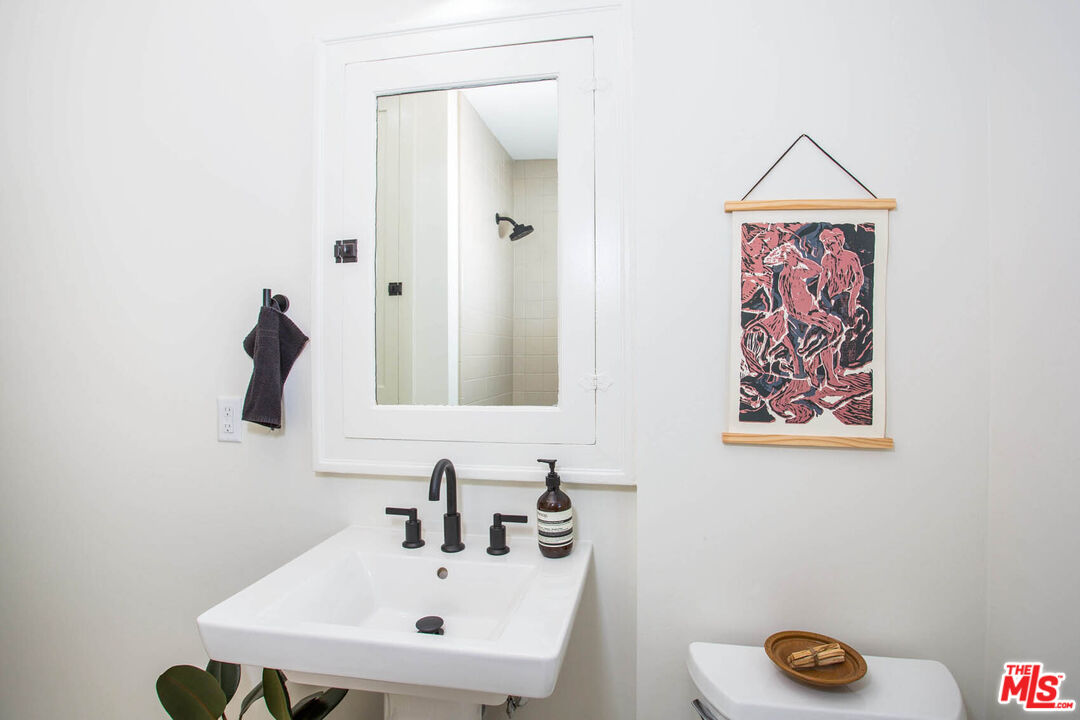 3756 Dover Place Los Angeles, CA 90039 - Photo 13 of 19 a bathroom with a sink and a mirror