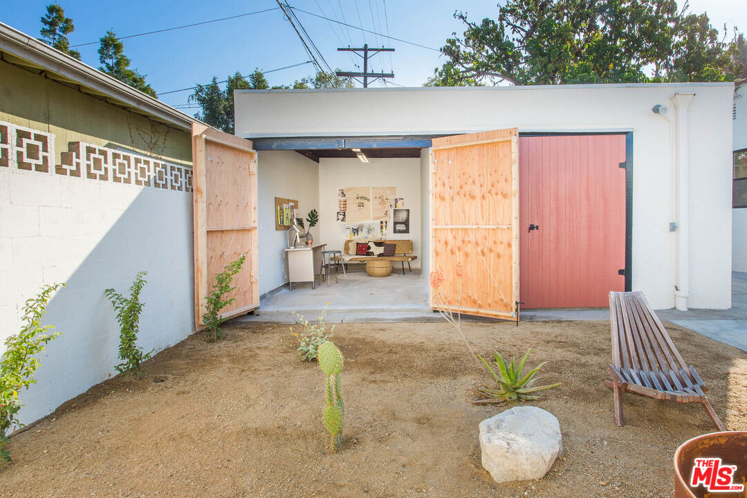 3756 Dover Place Los Angeles, CA 90039 - Photo 17 of 19 a backyard of a house with table and chairs
