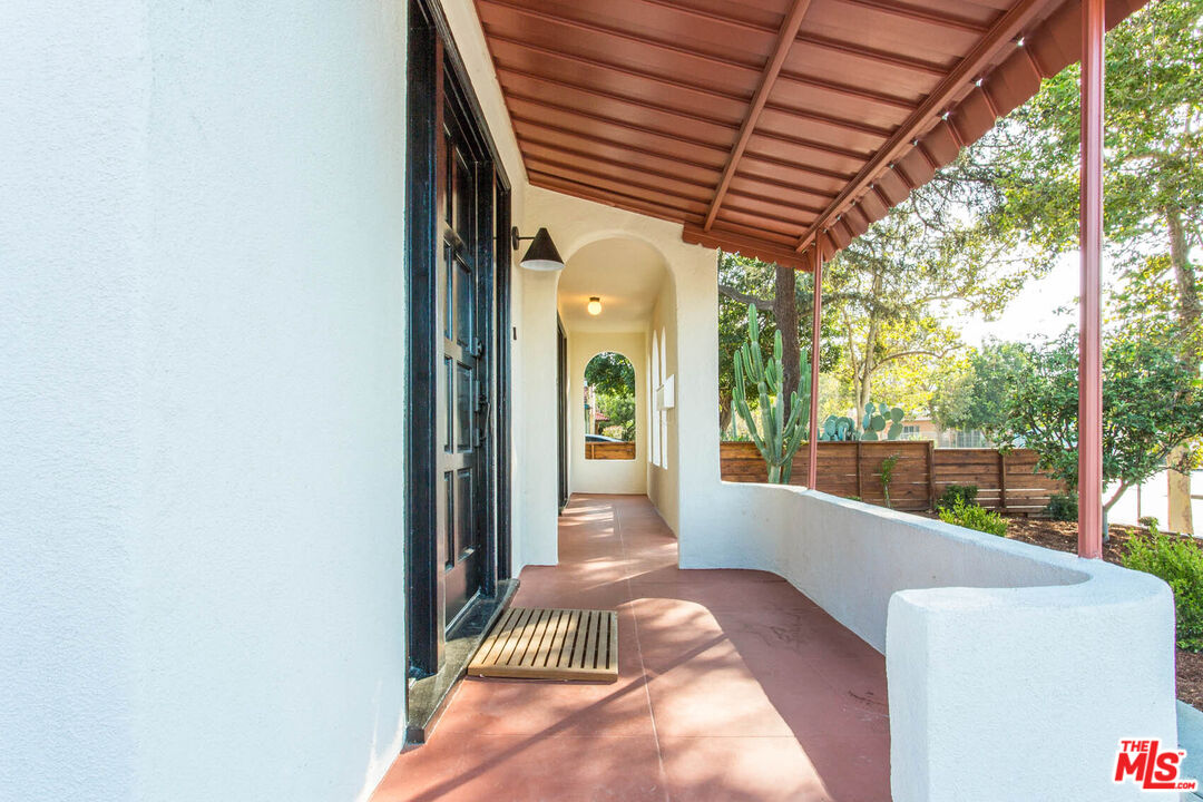 3756 Dover Place Los Angeles, CA 90039 - Photo 2 of 19 a view of a porch with furniture and garden