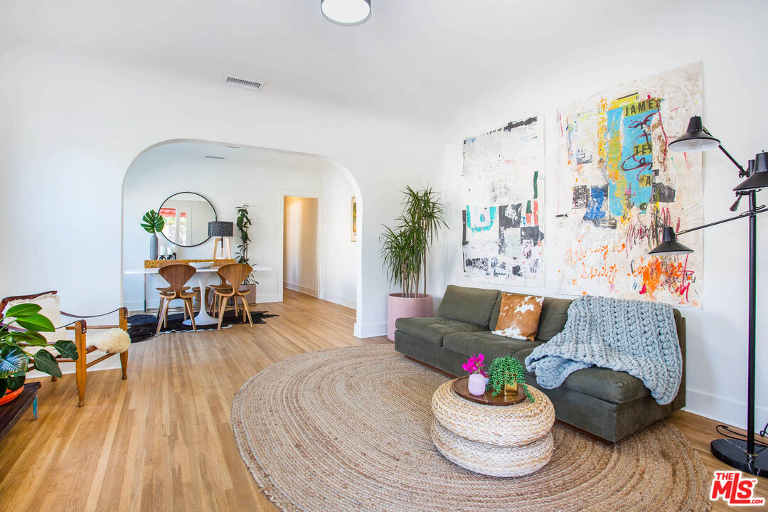 3756 Dover Place Los Angeles, CA 90039 - Photo 3 of 19 a living room with furniture and a chandelier