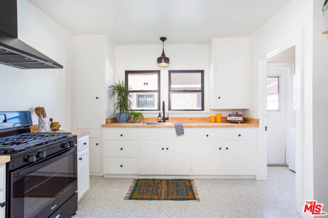 3756 Dover Place Los Angeles, CA 90039 - Photo 7 of 19 a kitchen with stainless steel appliances a stove a sink and a refrigerator