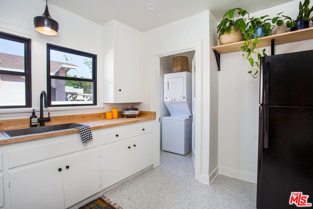 3756 Dover Place Los Angeles, CA 90039 - Photo 9 of 19 a view of a kitchen with a refrigerator cabinets and a window