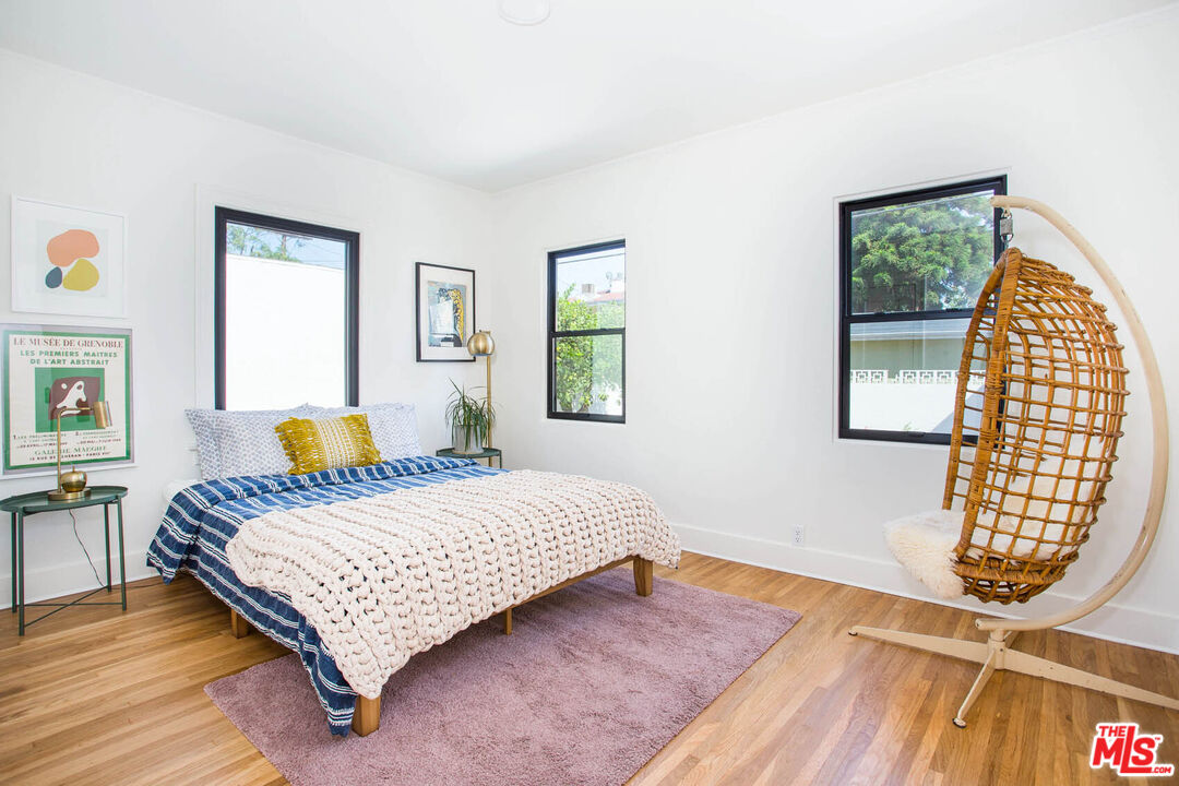 3756 Dover Place Los Angeles, CA 90039 - Photo 10 of 19 a bedroom with a bed and wooden floor