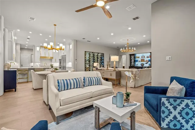 a large kitchen with a large counter top appliances and cabinets