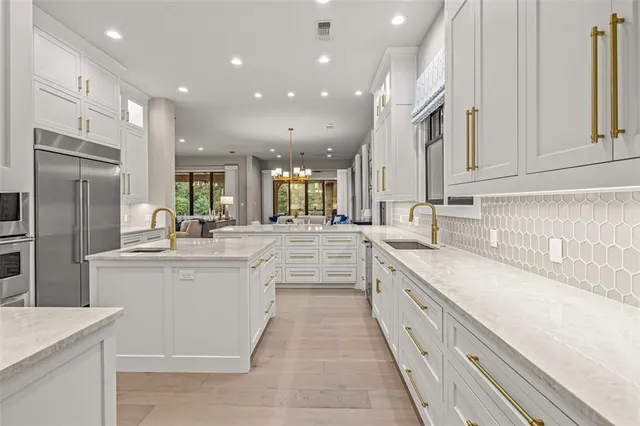 a bedroom with a large bed and a large window